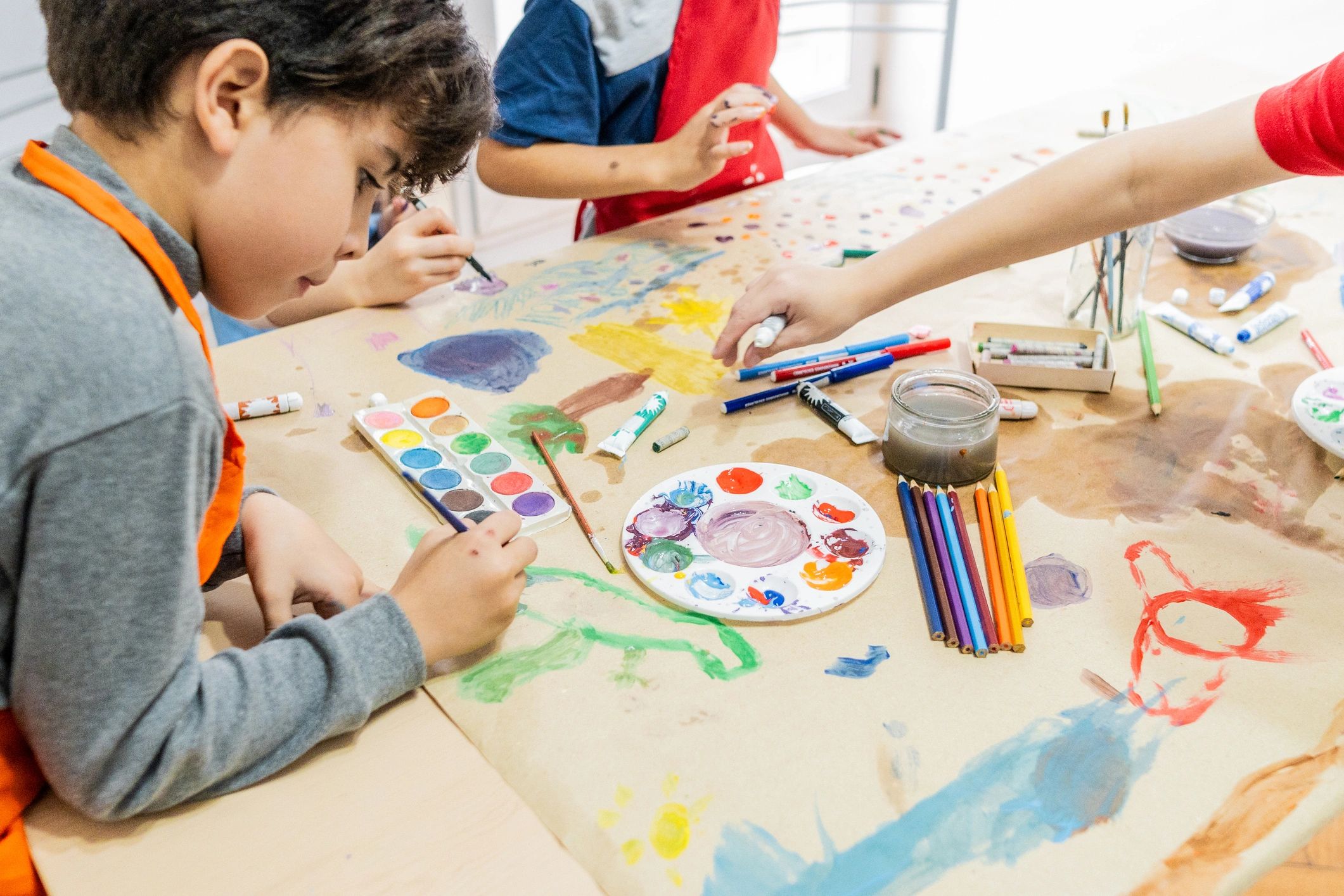 Child painting during an art activity