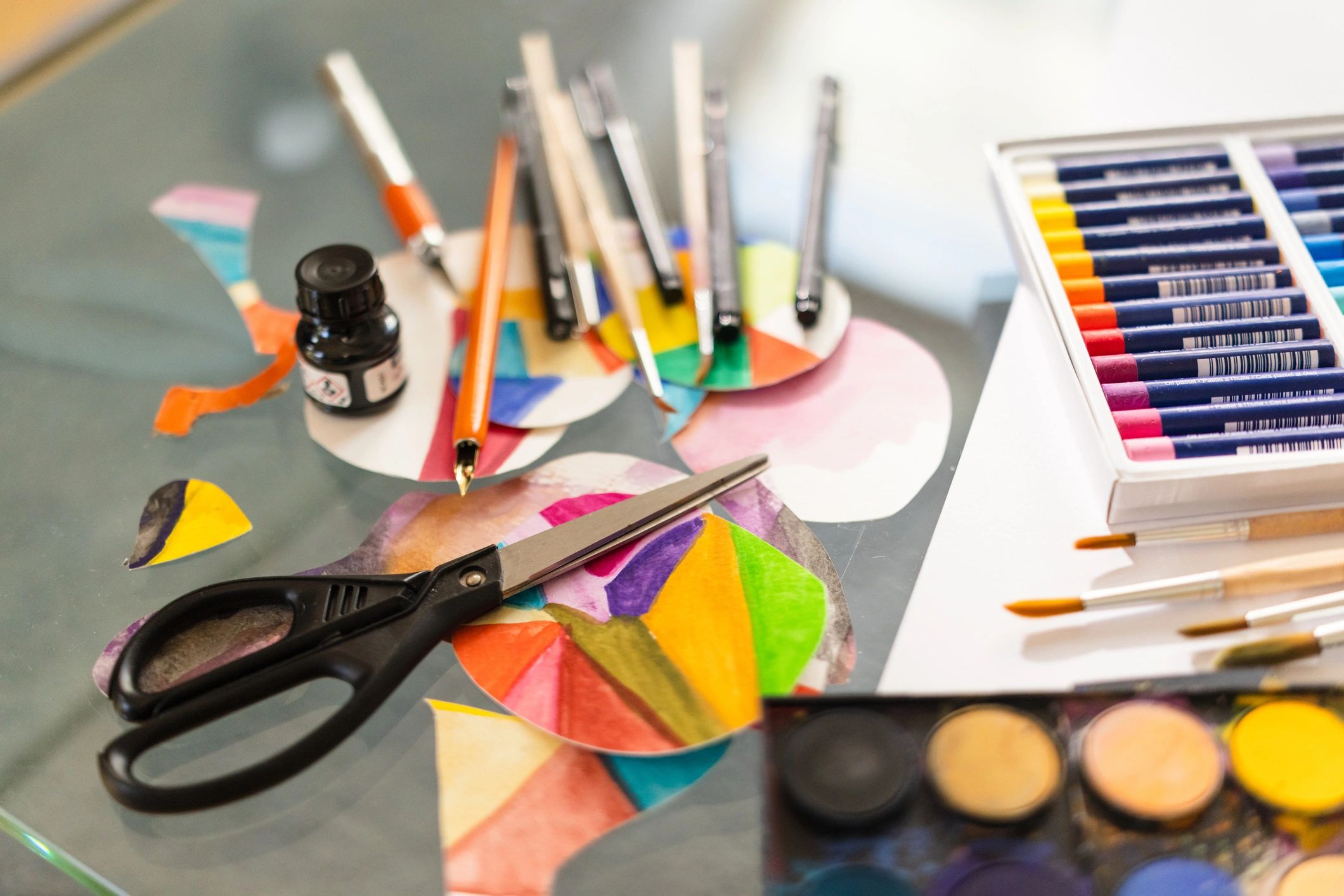 Colorful watercolor paints and art supplies