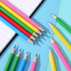 Pencils of various colors placed on a blue paper, children's learning stationery
